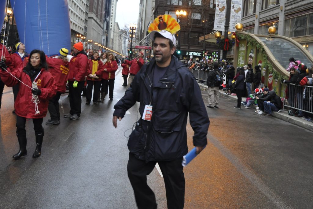 John coordinating the balloon team, adorning an awesome turkey hat.