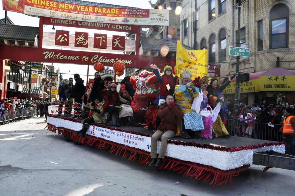 A parade float in front of the gateway in Chinatown, Chicago during the Chinese New Year Parade
